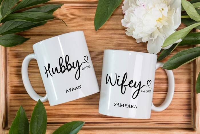 Personalized mugs can be customized with the couple's names, wedding date, or a special message